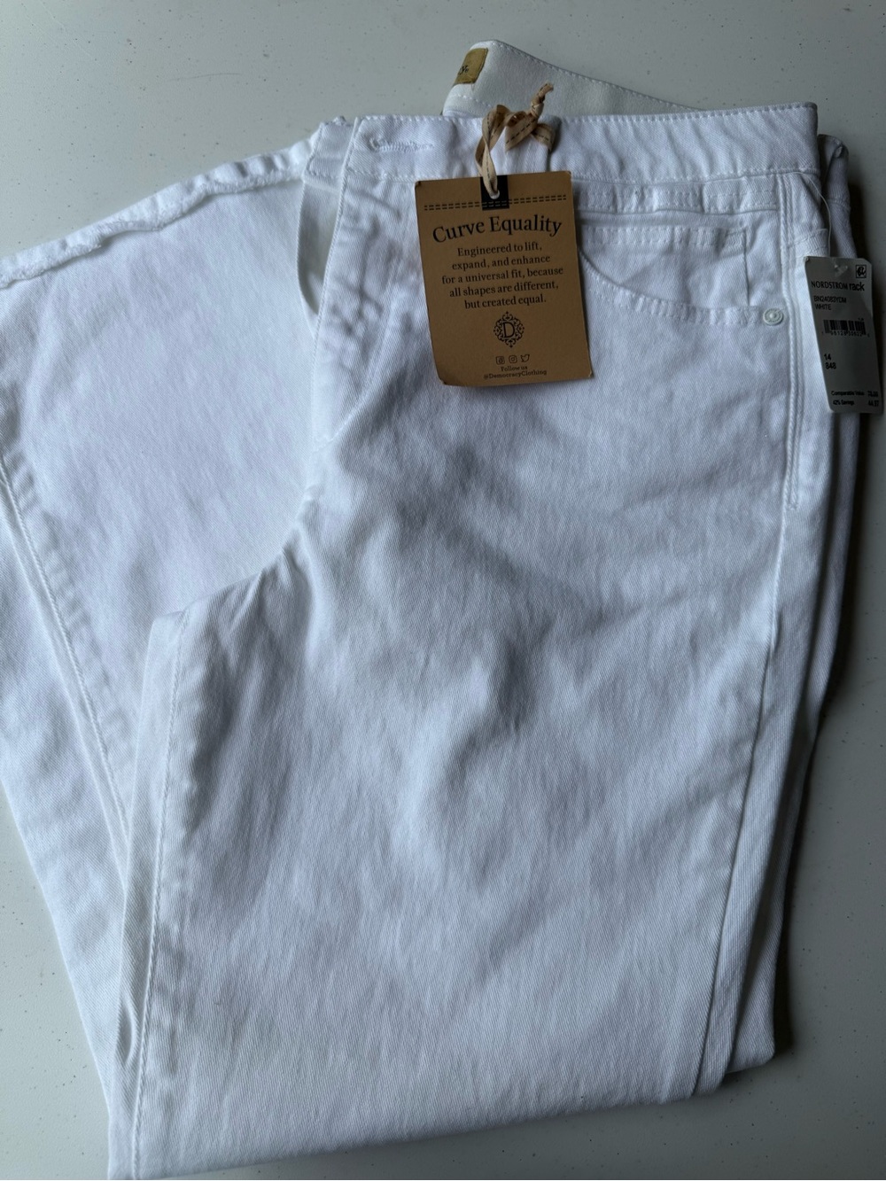 New women’s white Democracy Jeans with frayed bottoms, size 14